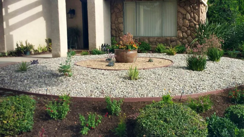 Circular rock patterns highlight this front lawn replacement design