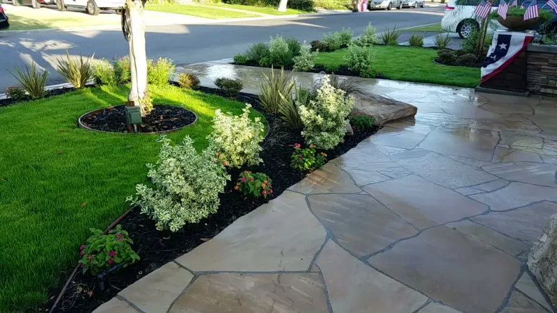 Flagstone walkway and grass and trees