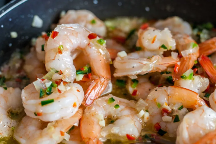 shrimp seasons with garden herbs and homegrown peppers