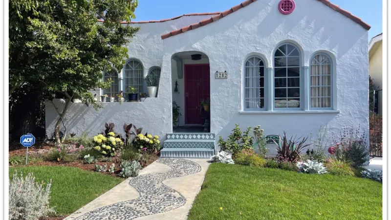 Colorful, textured base plantings accent this lush lawn