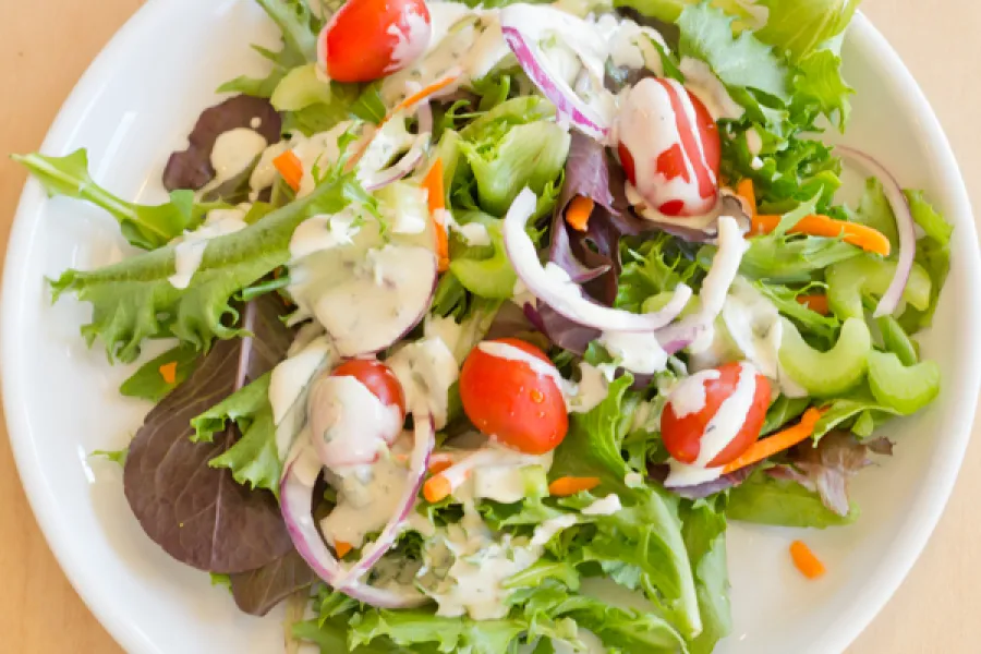 a bowl of salad on a plate