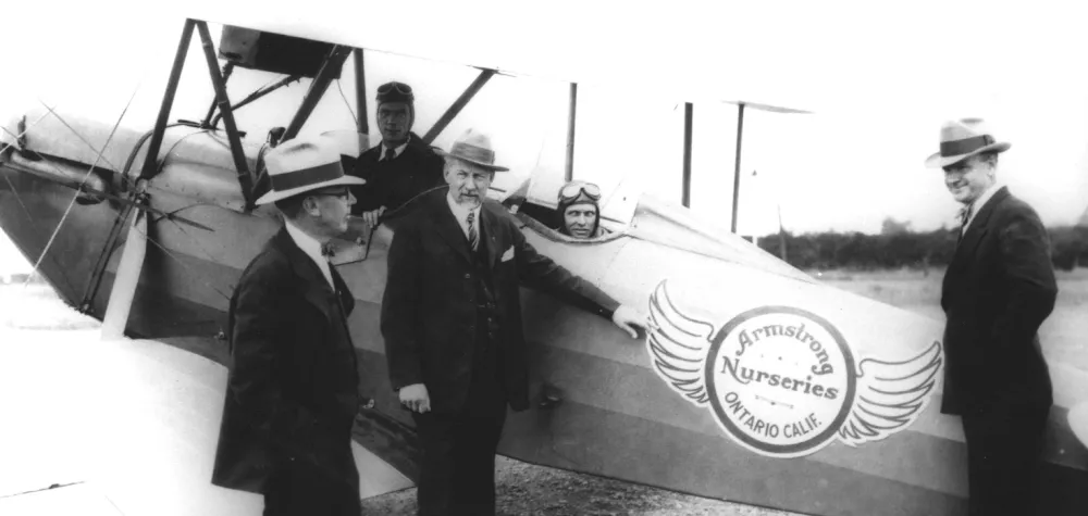 a man standing in front of a plane