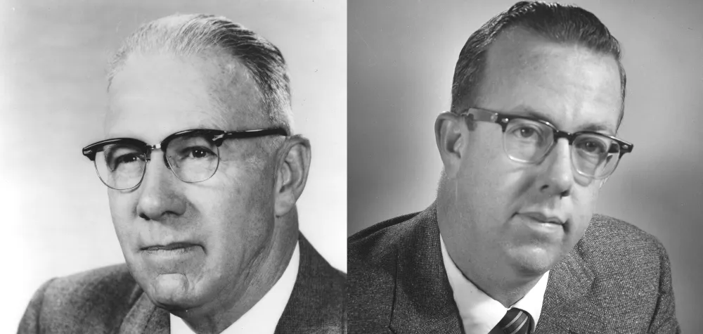 a man wearing glasses posing for the camera