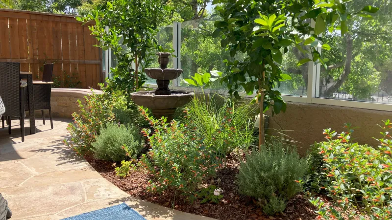 A fountain highlights this outdoor living area 