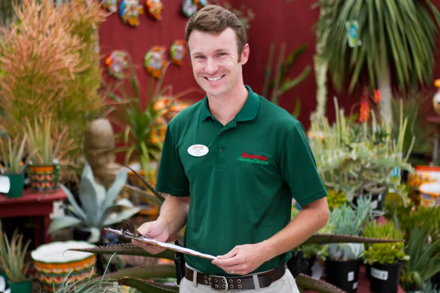 Male Armtrong associate with clipboard in the succulent section