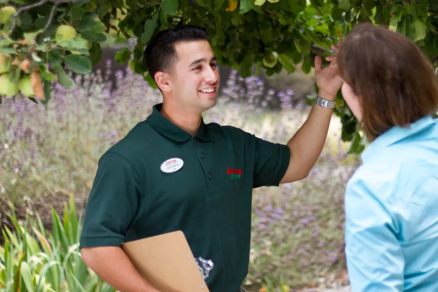 a man that is standing in the grass